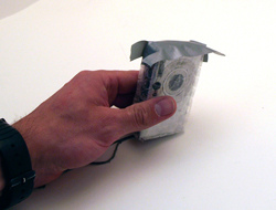 Cut and fold the duct tape to form it around the corners of the case.