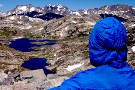 Eric Vann looks at the horizon of Big Beartooth Peaks, with Fossil Lake in the distance.