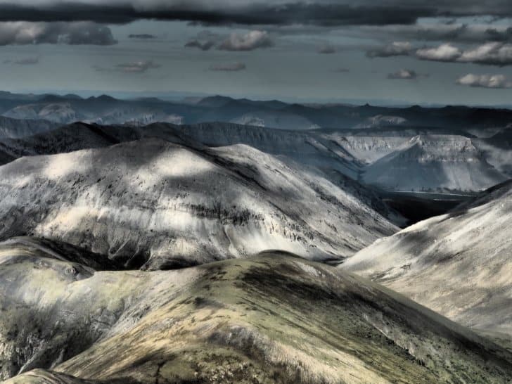 Nahanni River by Canoe: Rugged mountains viewed from the sky.