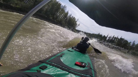 Nahanni River by Canoe: The front of the canoe pushes through rapids