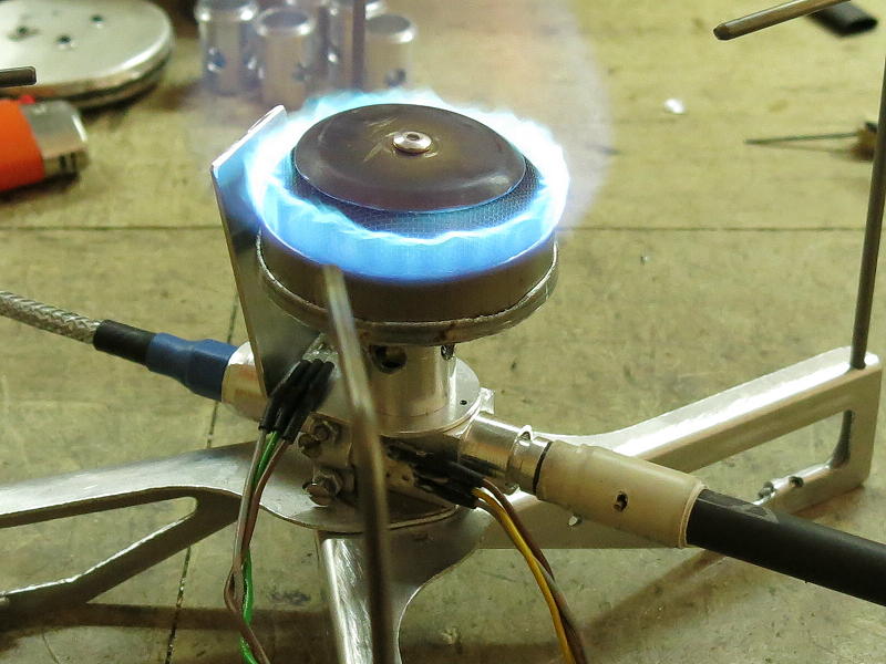 a lit stove with sensors attached.