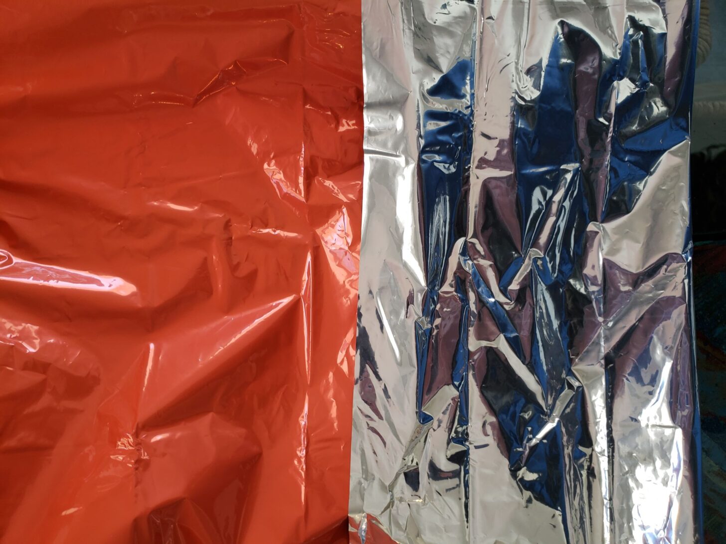 mylar space blanket fabric comparison, orange on left, silver on right