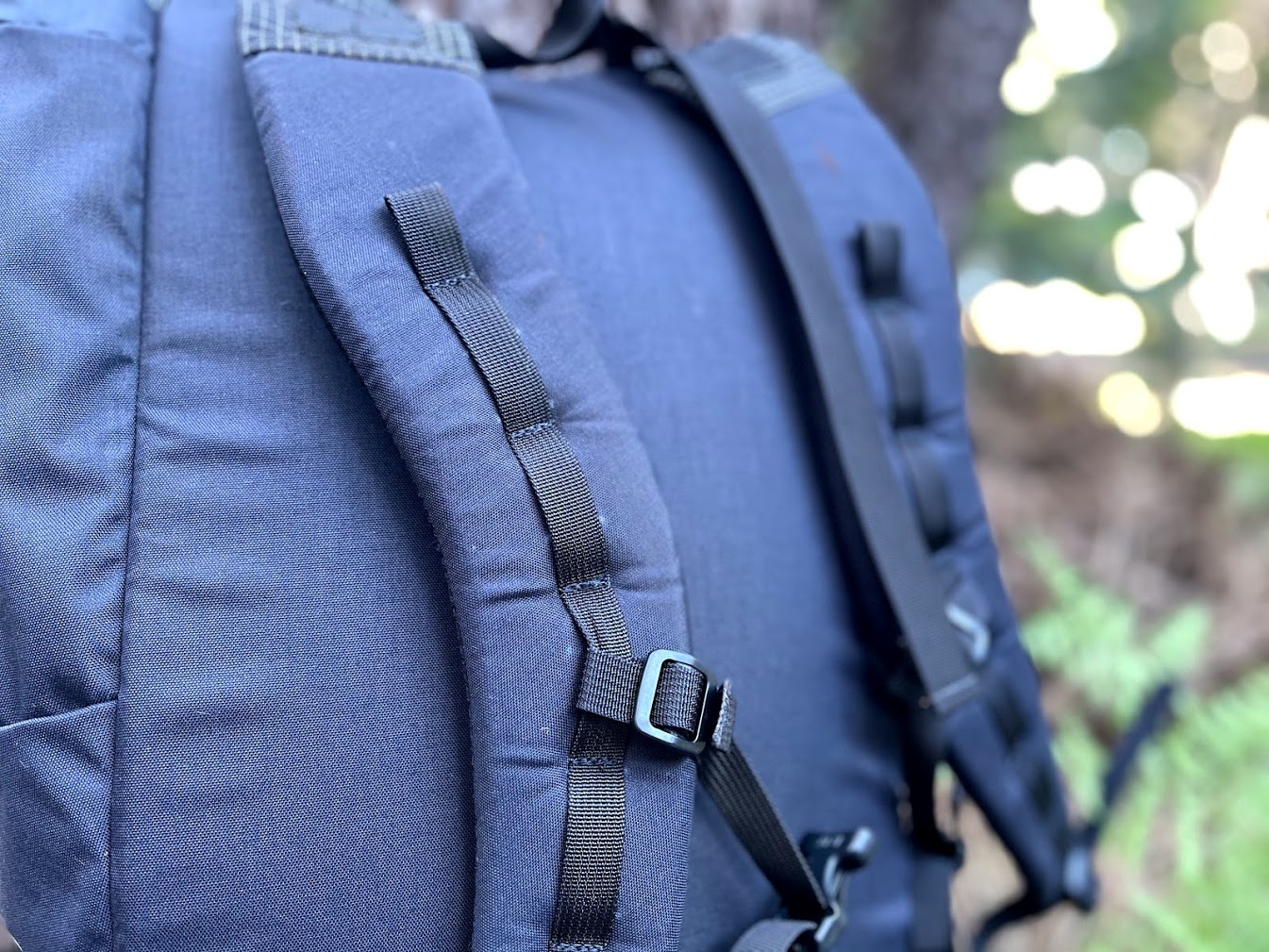 a close up of of the pack's shoulder straps showing six or seven daisy chains.