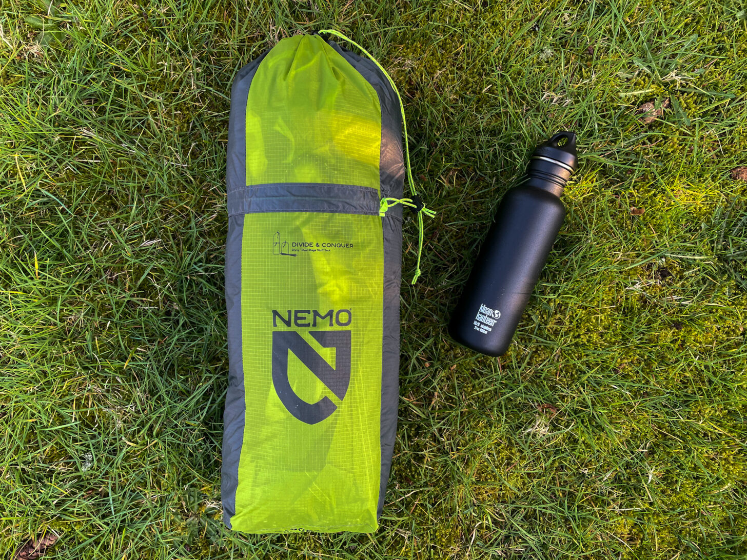 a large stuff sack with a 1 liter water bottle next to it for scale.