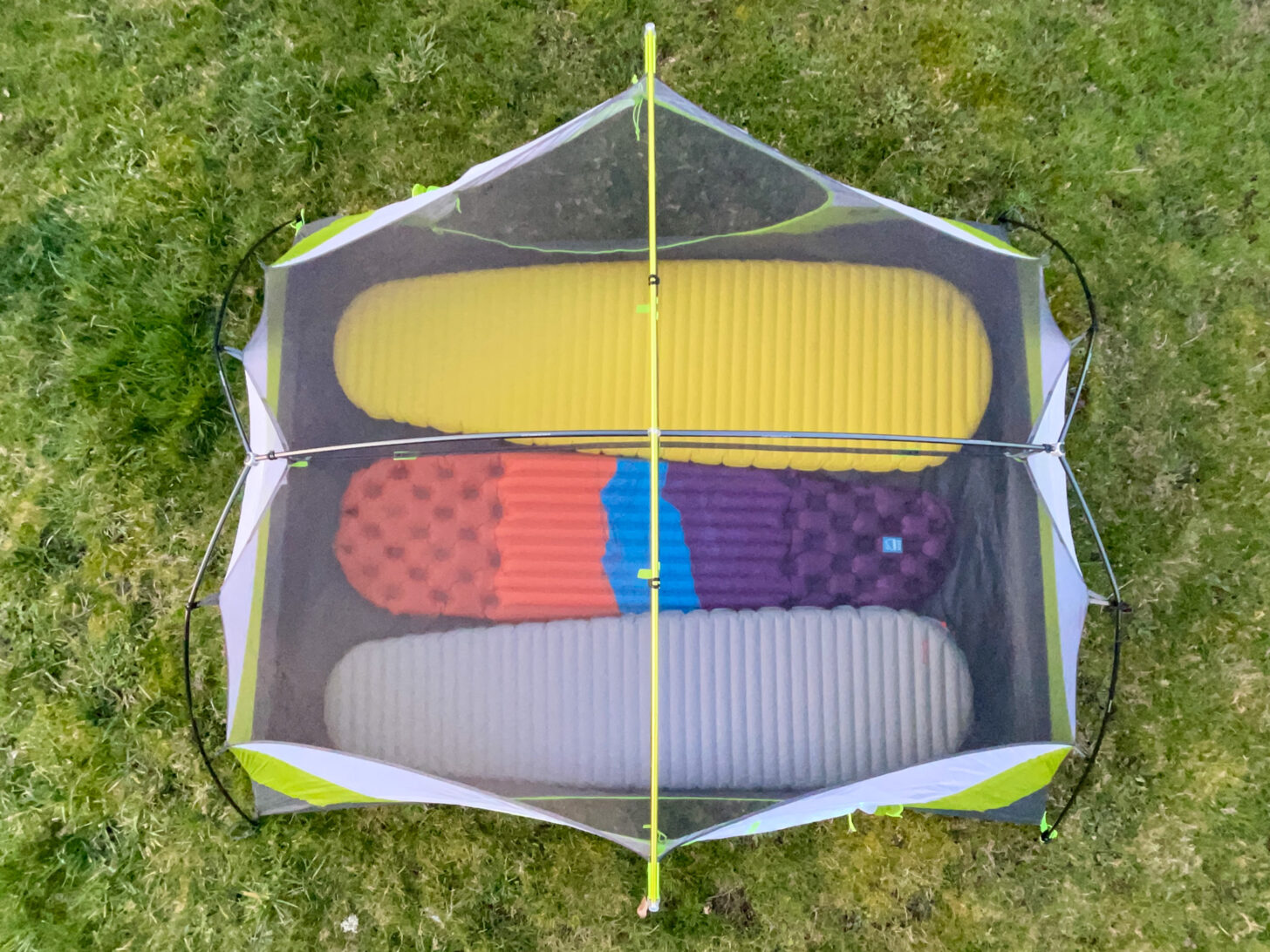 an overhead shot showing how tightly three pads fit inside the shelter.