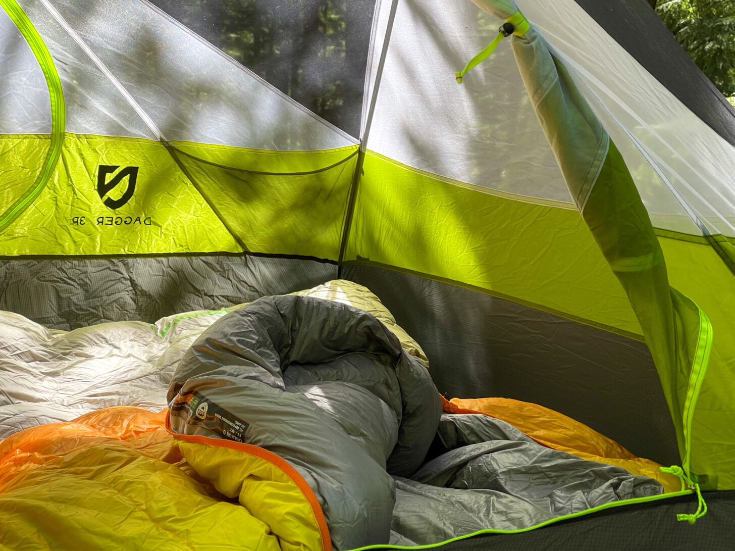 A shot into the interior of the tent with the fly and mesh door rolled up.