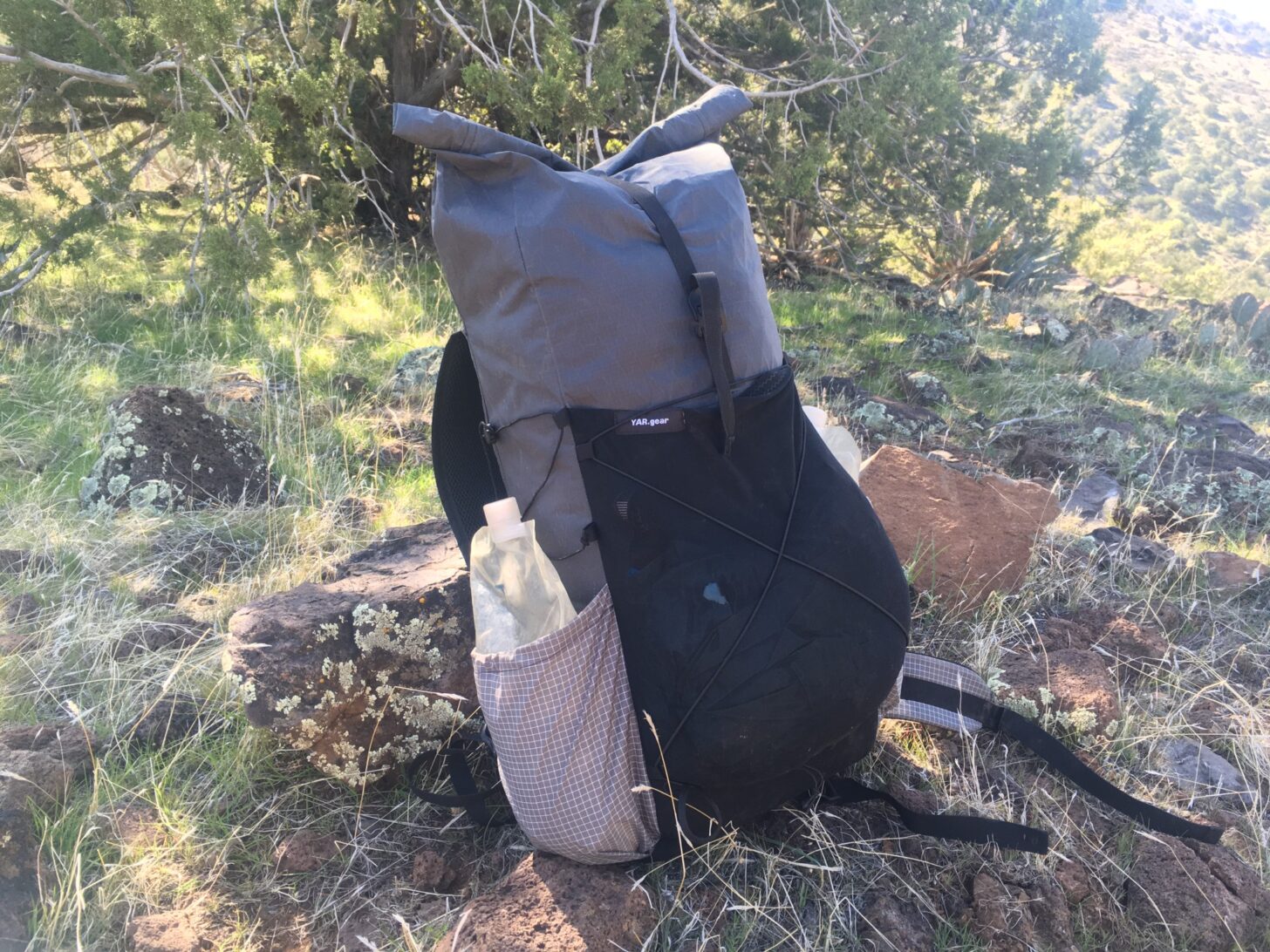 A loaded pack sits on the ground.