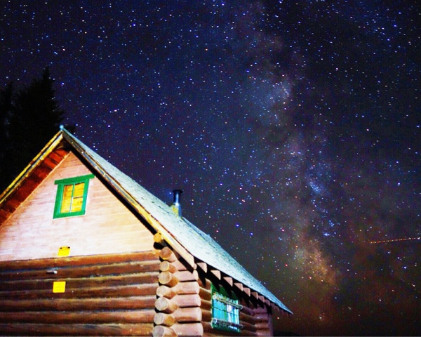 cabin at night with milky way galaxy