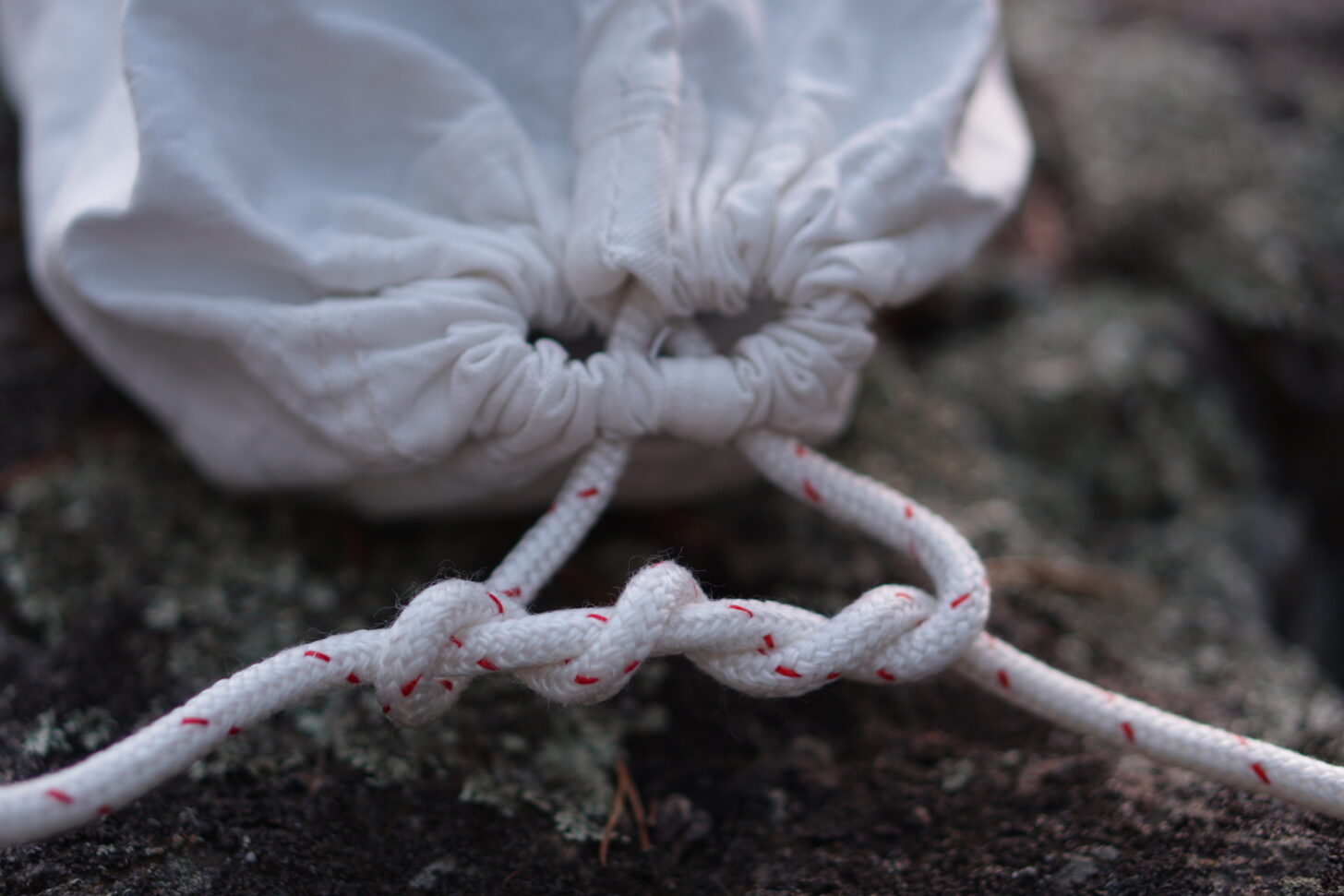 The double (or triple) overhand knot is recommended to secure the cinched opening of the Ursack. Photo: Ryan Jordan.