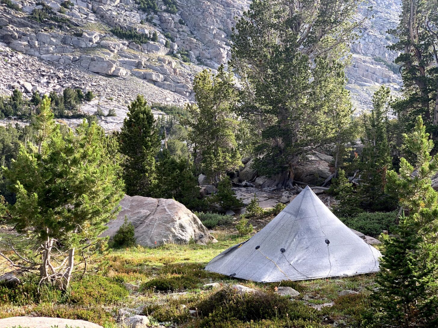 A landscape where using an Ursack is an ideal food storage option. Near the whitebark-pine treeline of a mountainous alpine area in Wyoming, where limbs for hanging a bear bag are limited, but small-diameter trees are plentiful. Photo: Ryan Jordan.