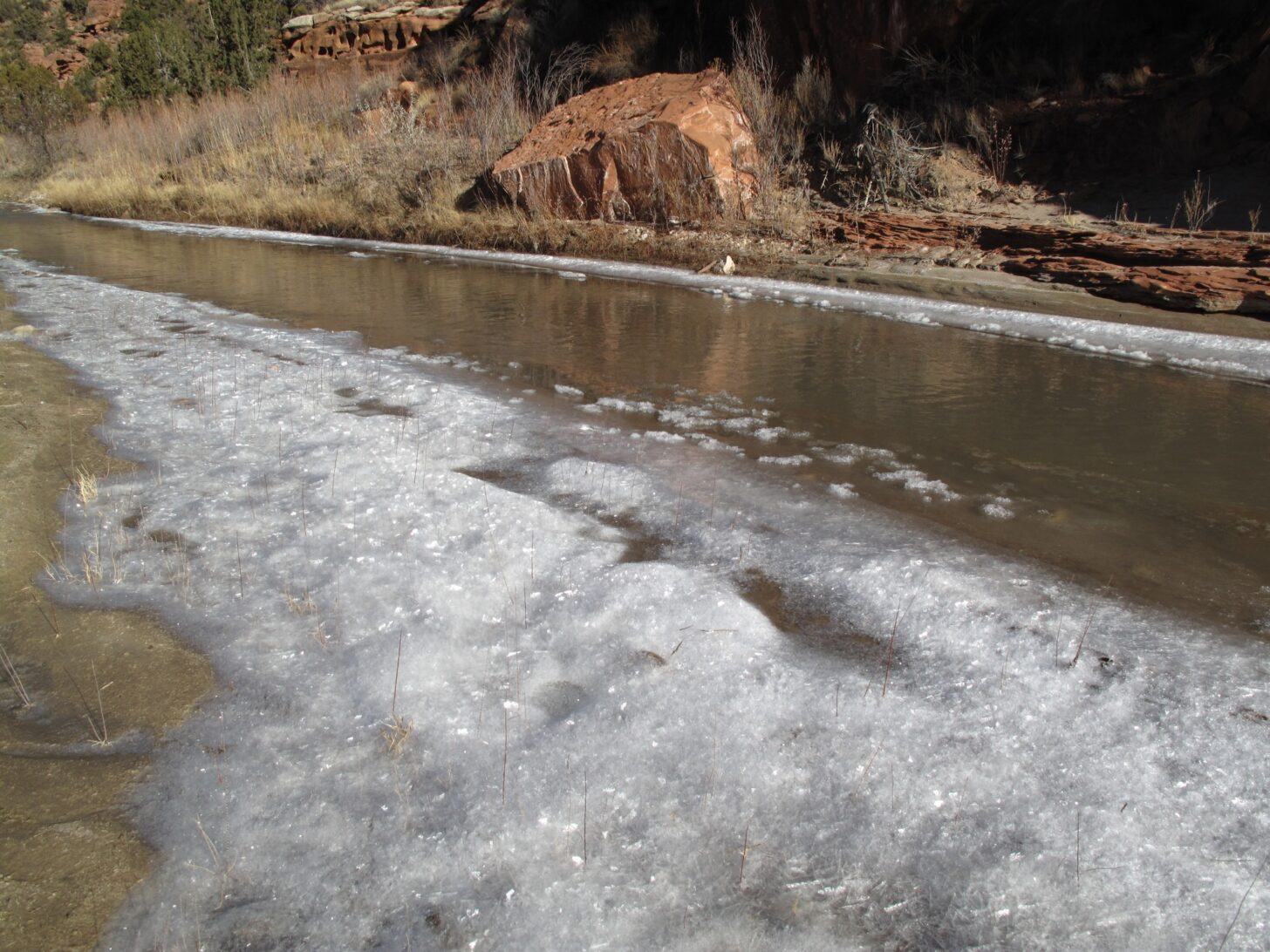 a frozen riverbank