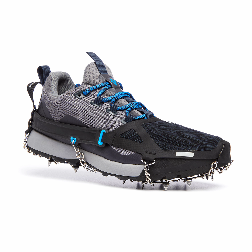 Black Diamond Distance Spike Traction Devices on a trail running shoe against a white background