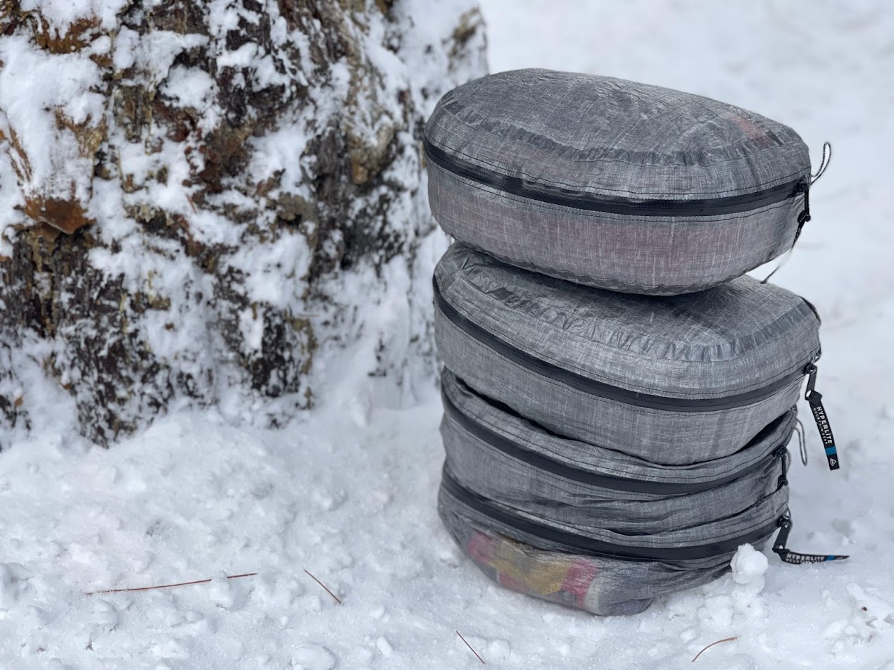 A stack of four hyperlight mountain gear pods