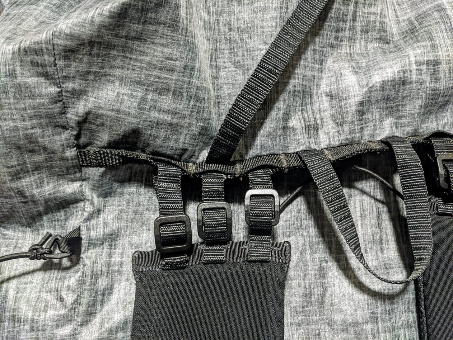 A close-up of the shoulder-strap attachment system on the Nashville Pack Cutaway backpack.