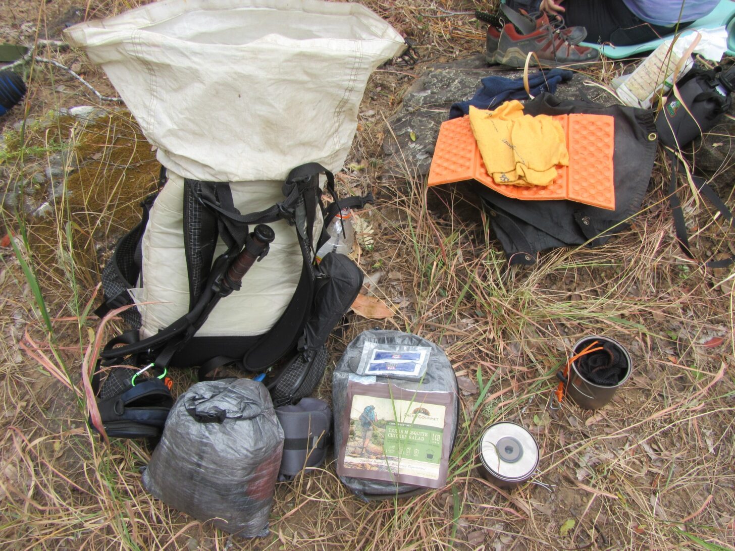various ultralight backpacking gear spread out over the ground