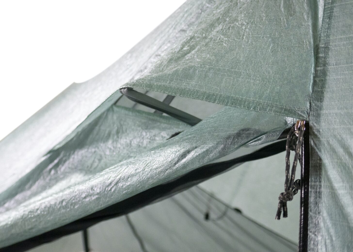 A tent vent is shown near a zipper.