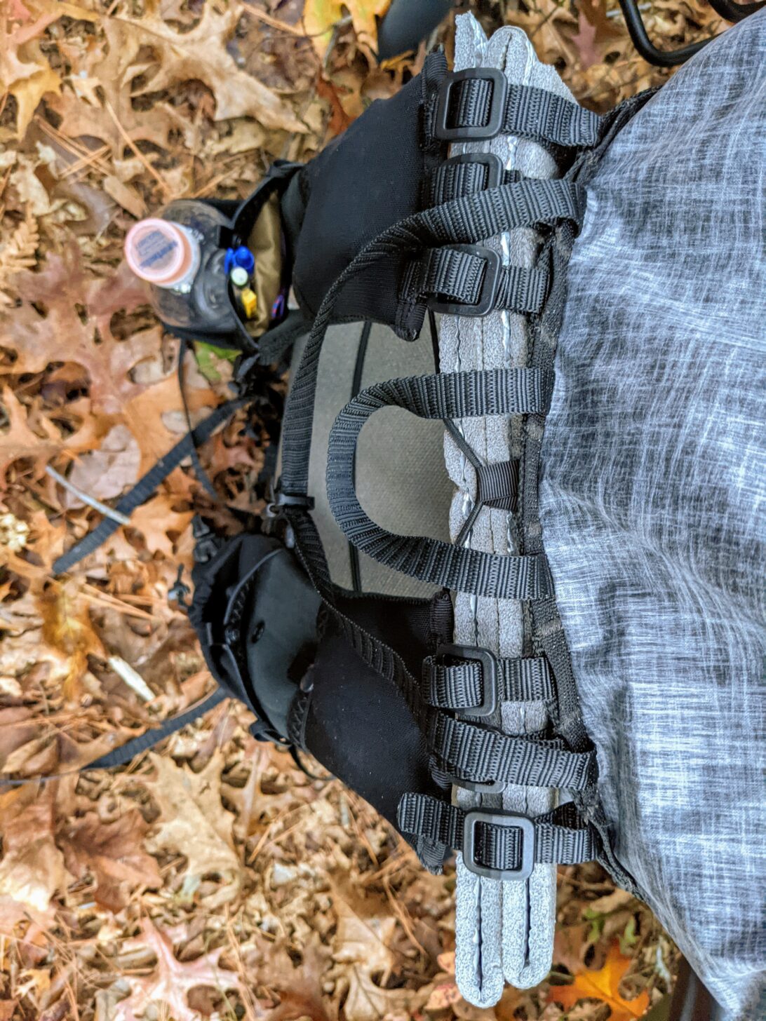 a shot from above demonstrating the shoulder-strap attachment system on the Nashville Pack Cutaway backpack.