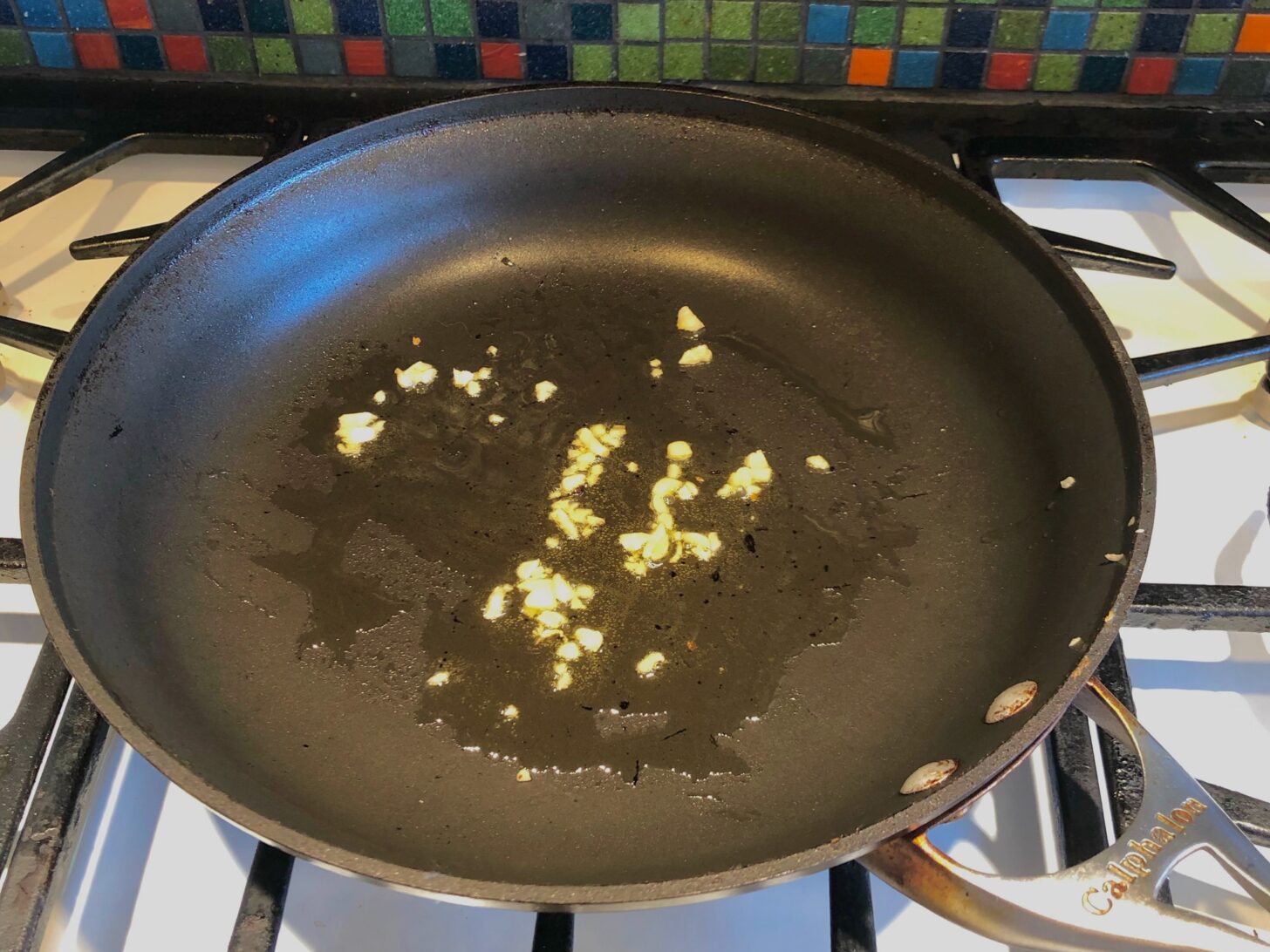 minced garlic cooking in a pan
