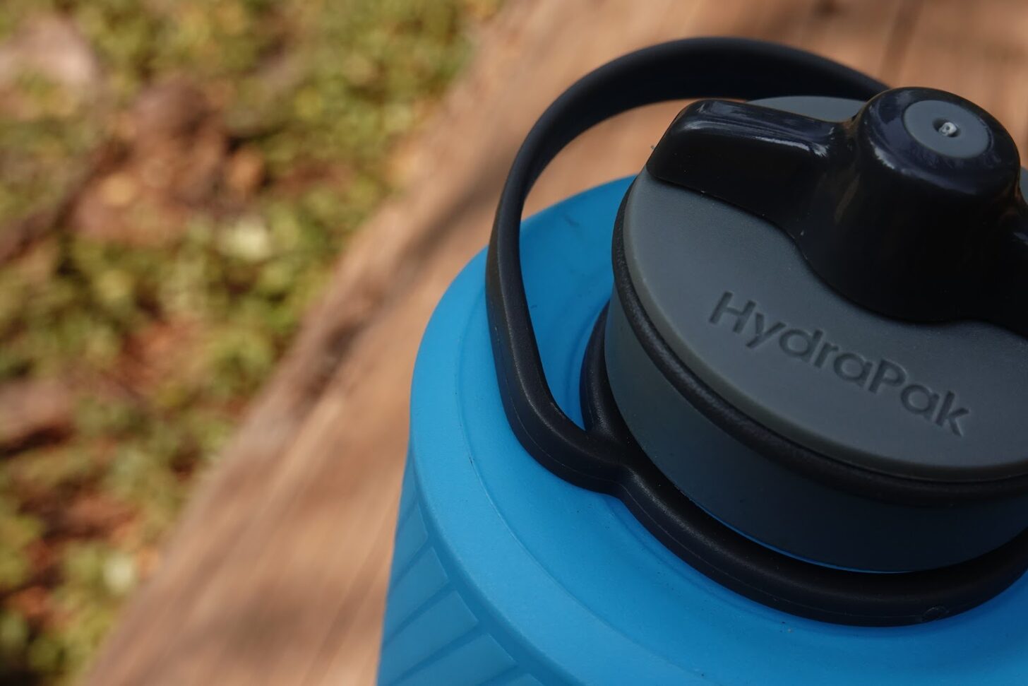 a close-up of a blue soft-side water bottle.