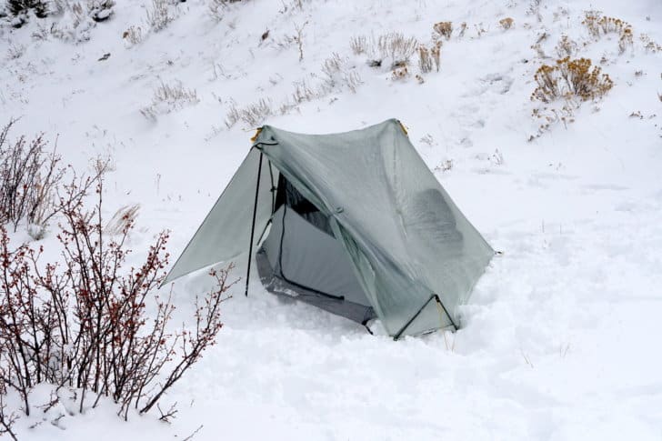 a tarptent notch li set up in a snowy clearing