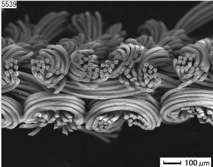 a black and white microscope image showing Octa fiber in a knit patter