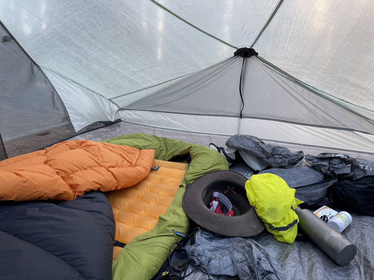 Gear scattered through the inside of a tent.