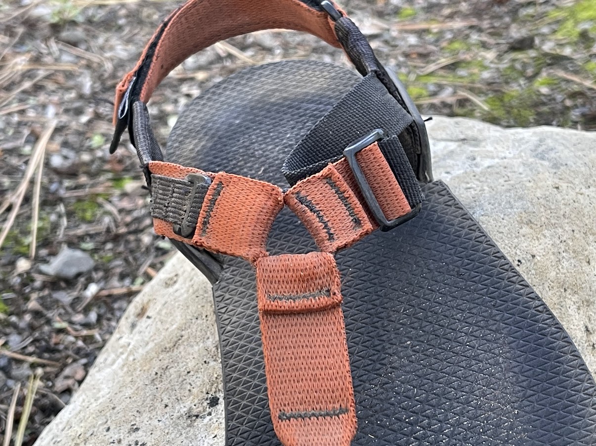 A close-up of the webbing system on the sandals.