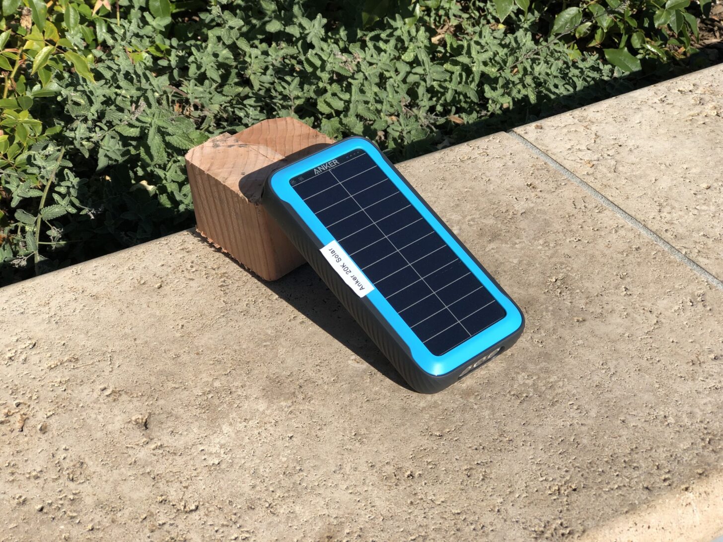 a solar-powered battery charger angled towards the sun