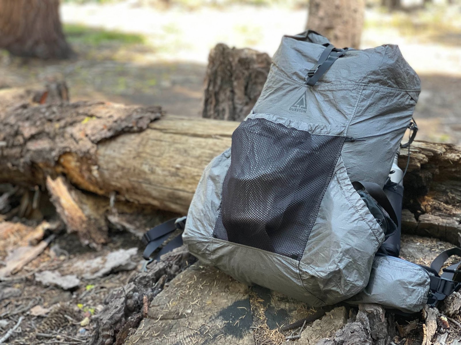 The Durston Kakwa 40 backpack resting against a log