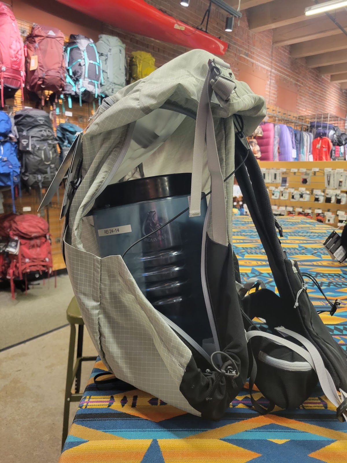 An Arc'teryx pack with a bearvault inside.