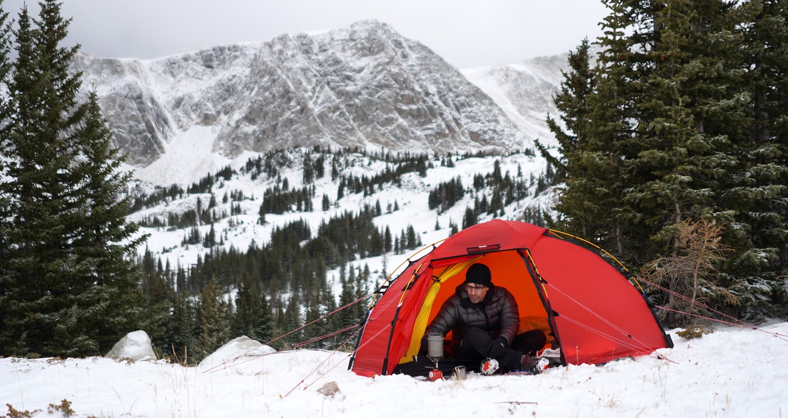 Tent at treeline in snow