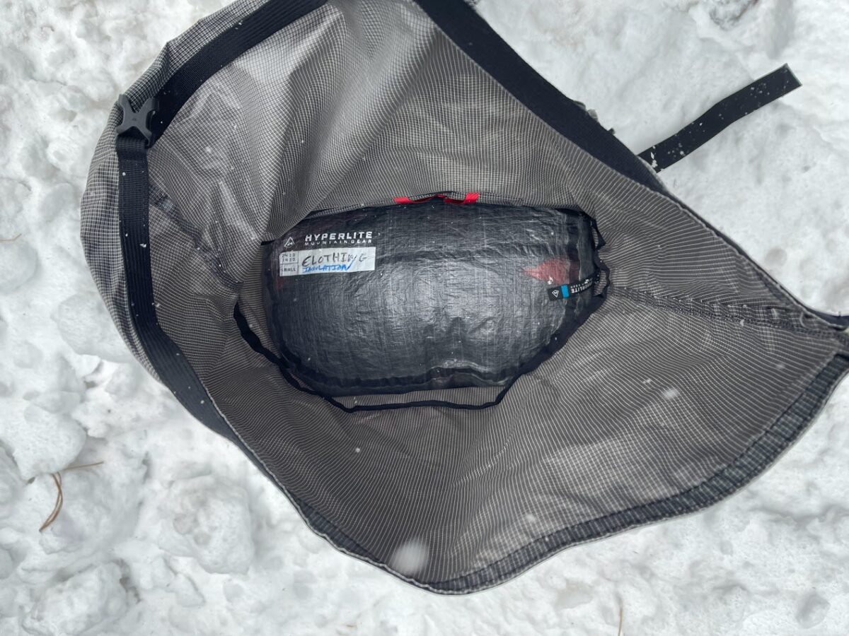 a shot straight down inside of a backpack showing a stuff sack