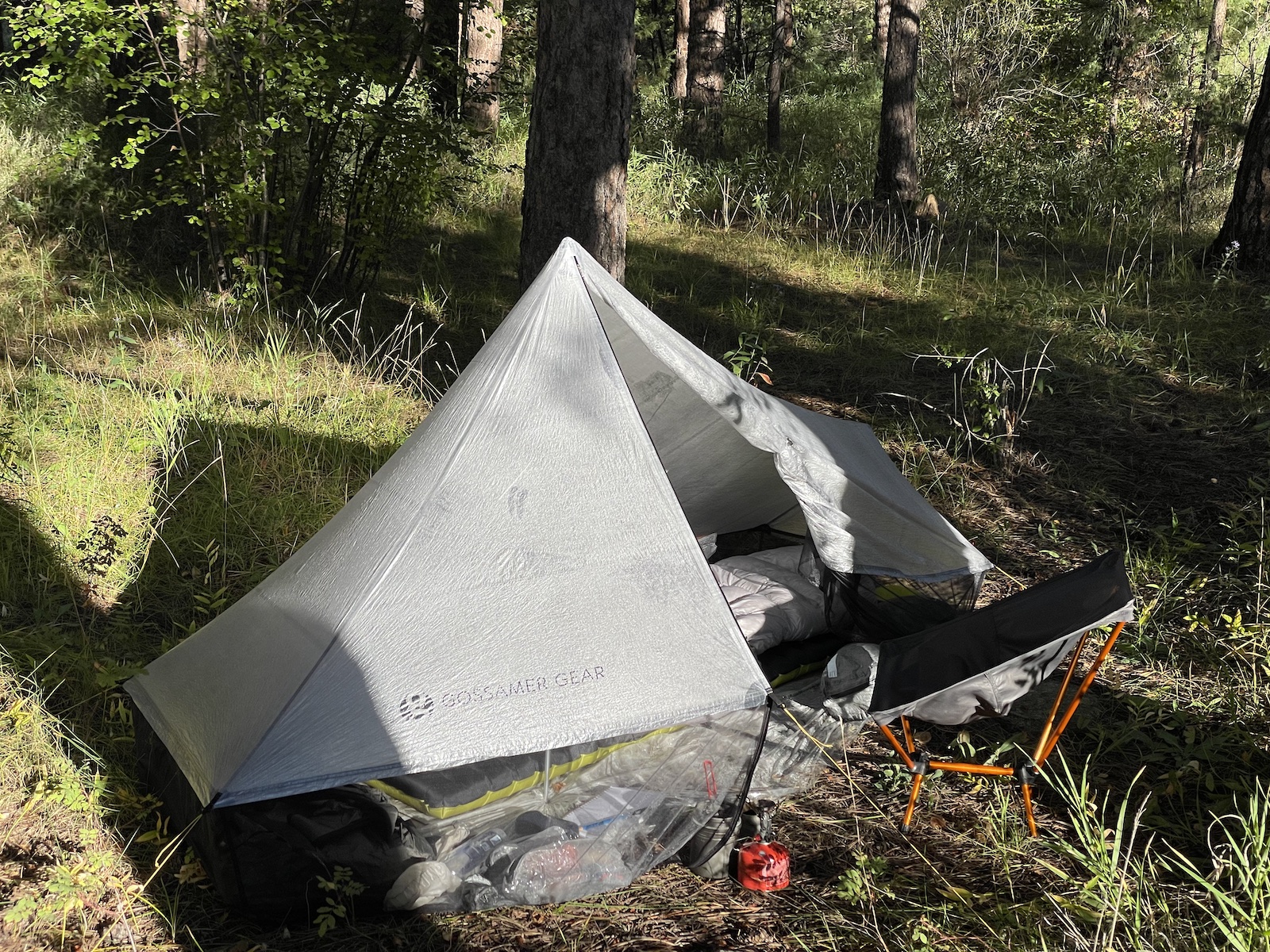 a tent is pitched up in the woods
