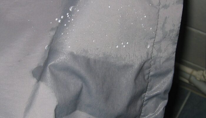 a close up of a person's shirt with water on it