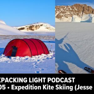 a picture of a snow covered mountain with a red tent