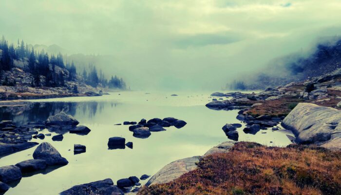 fog over an alpine lake