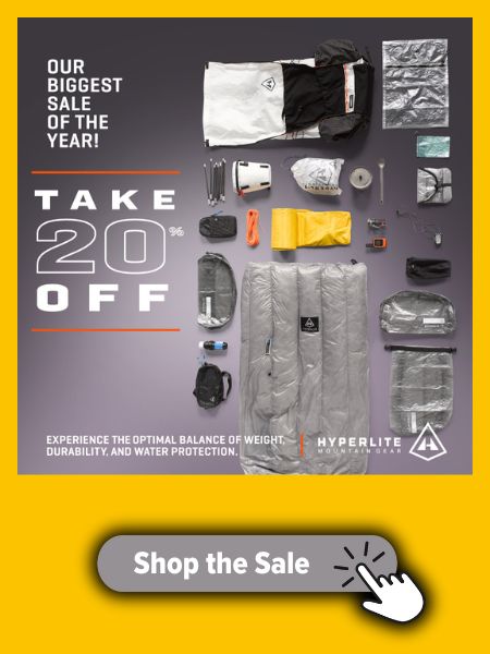 Advertisement for Hyperlite Mountain Gear's biggest sale of the year, offering 20% off select gear. The image showcases a flat lay of ultralight backpacking equipment, including a backpack, quilt, stuff sacks, and various accessories. The Hyperlite Mountain Gear logo is displayed at the bottom, along with a 'Shop the Sale' button in a yellow background with a hand-click icon.