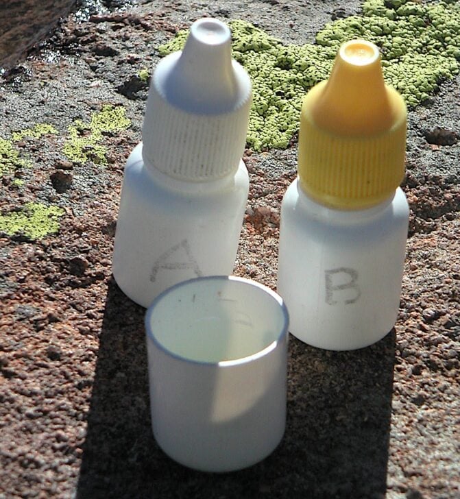 two tiny dropper bottles marked "A" and "B"