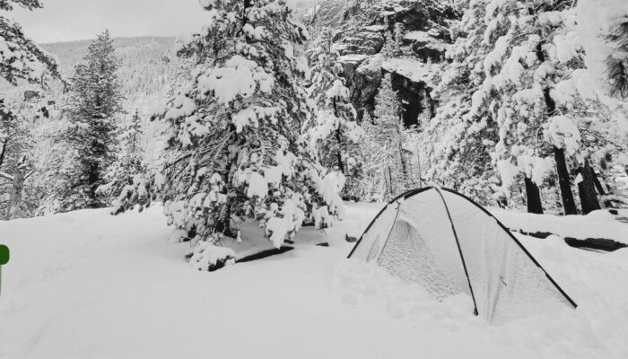 tent in snow, overlaid with the geartrust.org logo