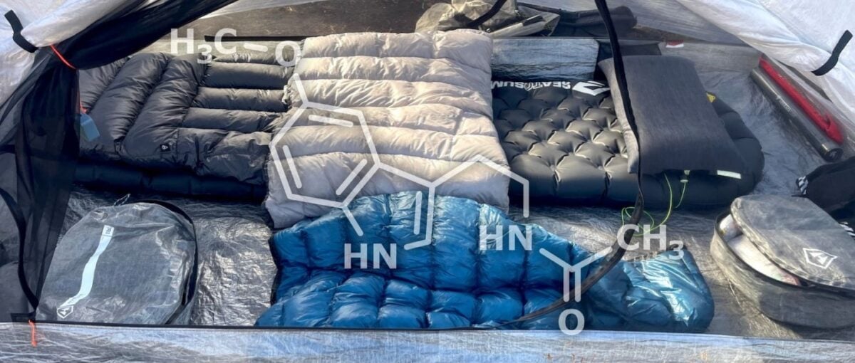 a tent with a sleep system inside - quilt, pad, pillow, down sweater; overlaid with the melatonin molecule