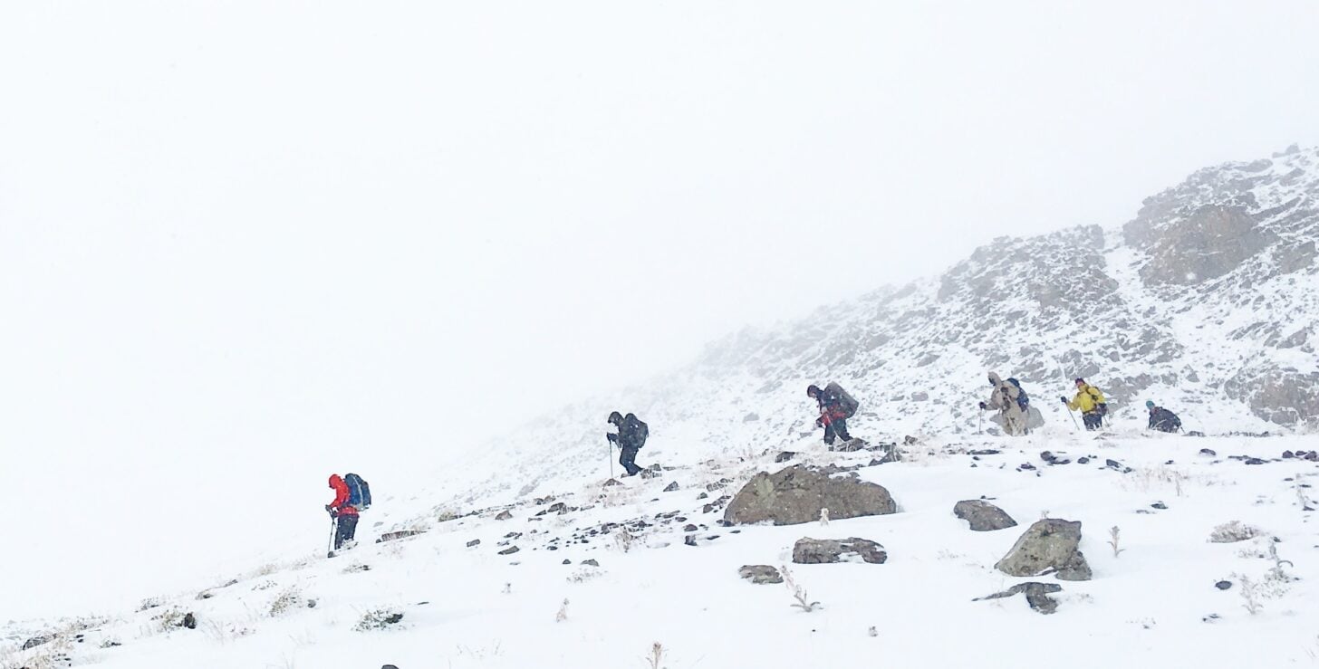 hikers in a snowy mountain landscape