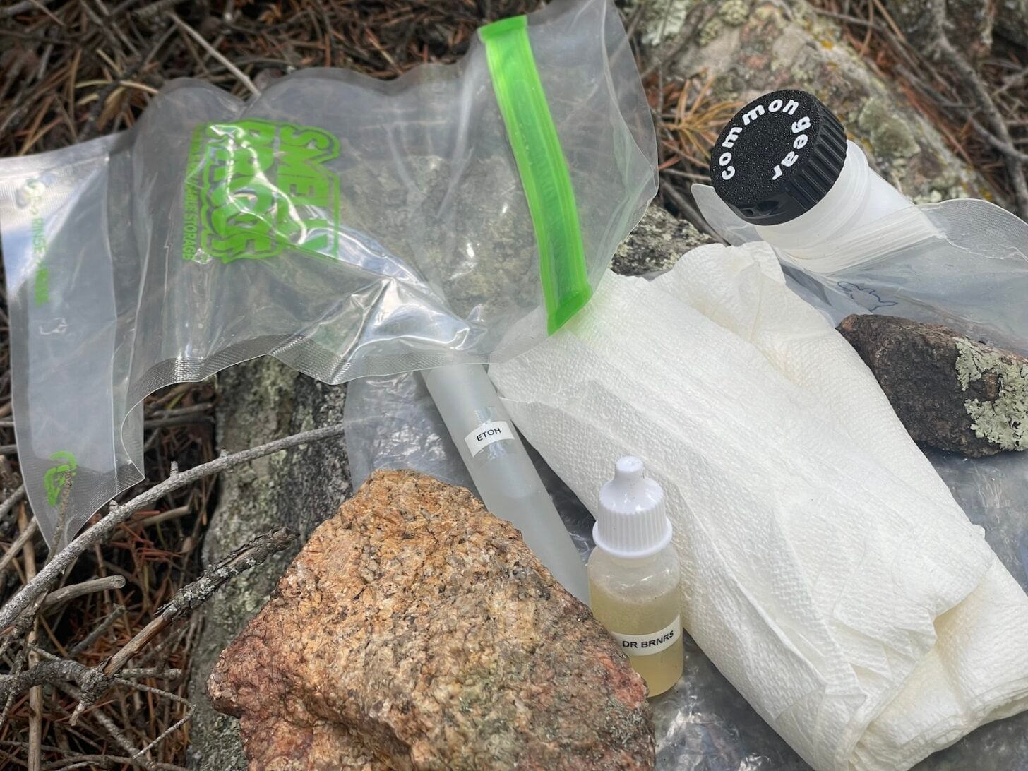 toilet kit for backpacking - odor proof toilet paper storage bag, soap/hand sanitizer, TP, and a bidet cap