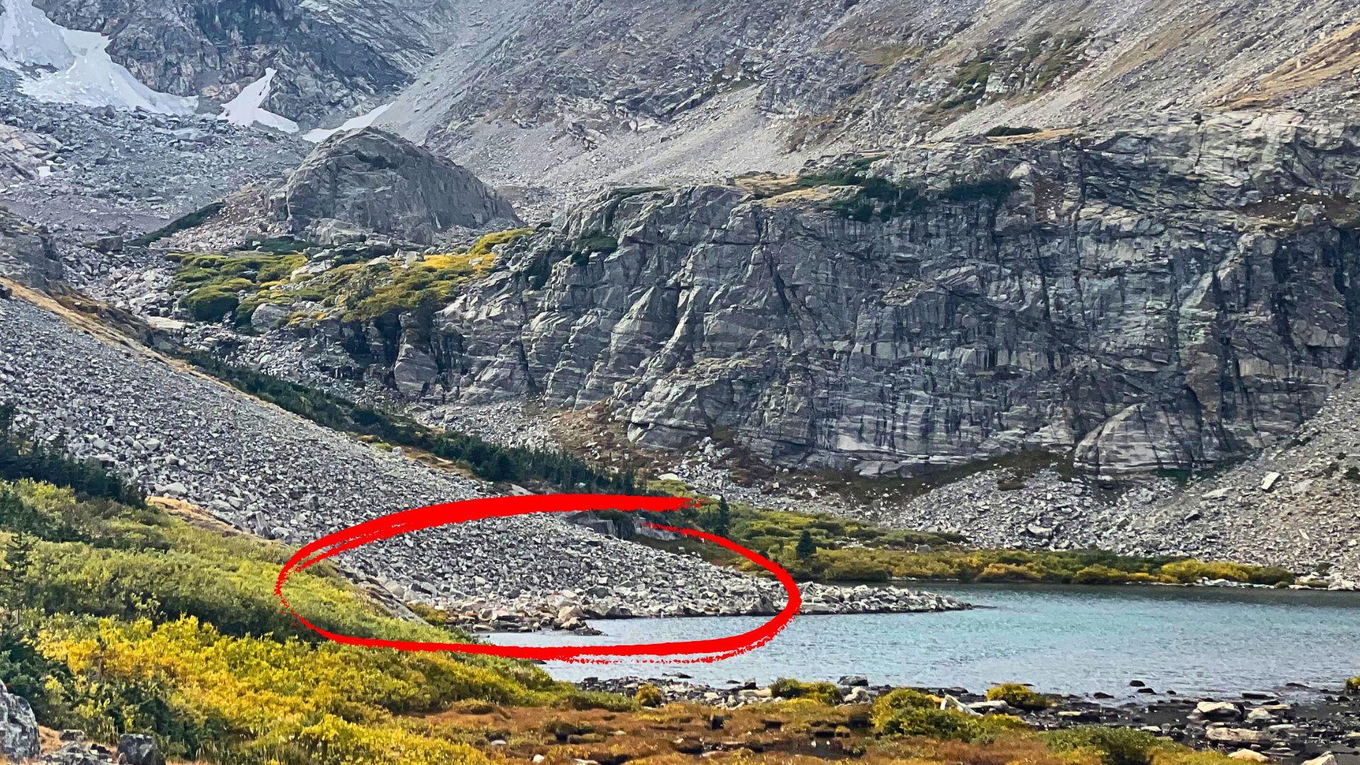 talus slope leading into a lake