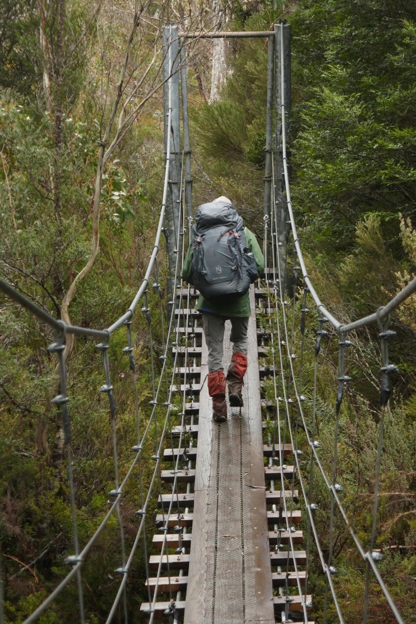 hiker on a bridge