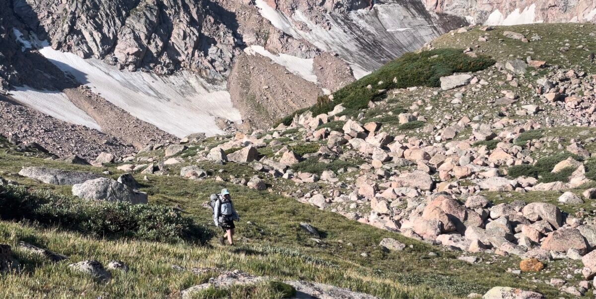 hiker in tundra, mountains