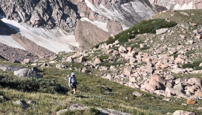 hiker in tundra, mountains