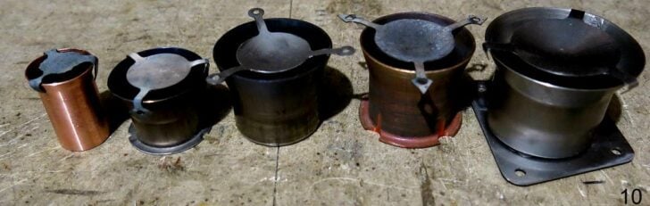Five prototype cylindrical stove burner and heat shield designs.