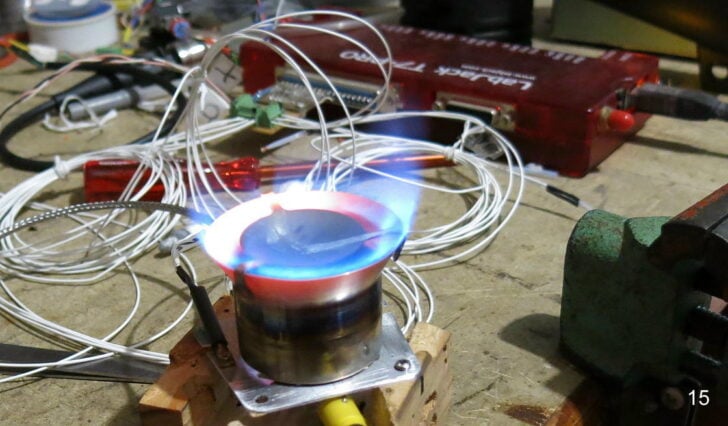 Stove burner undergoing a flame and temperature-sensor test.