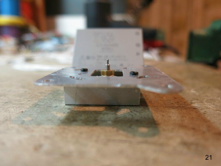 Close-up of a stove base plate with central fuel jet.