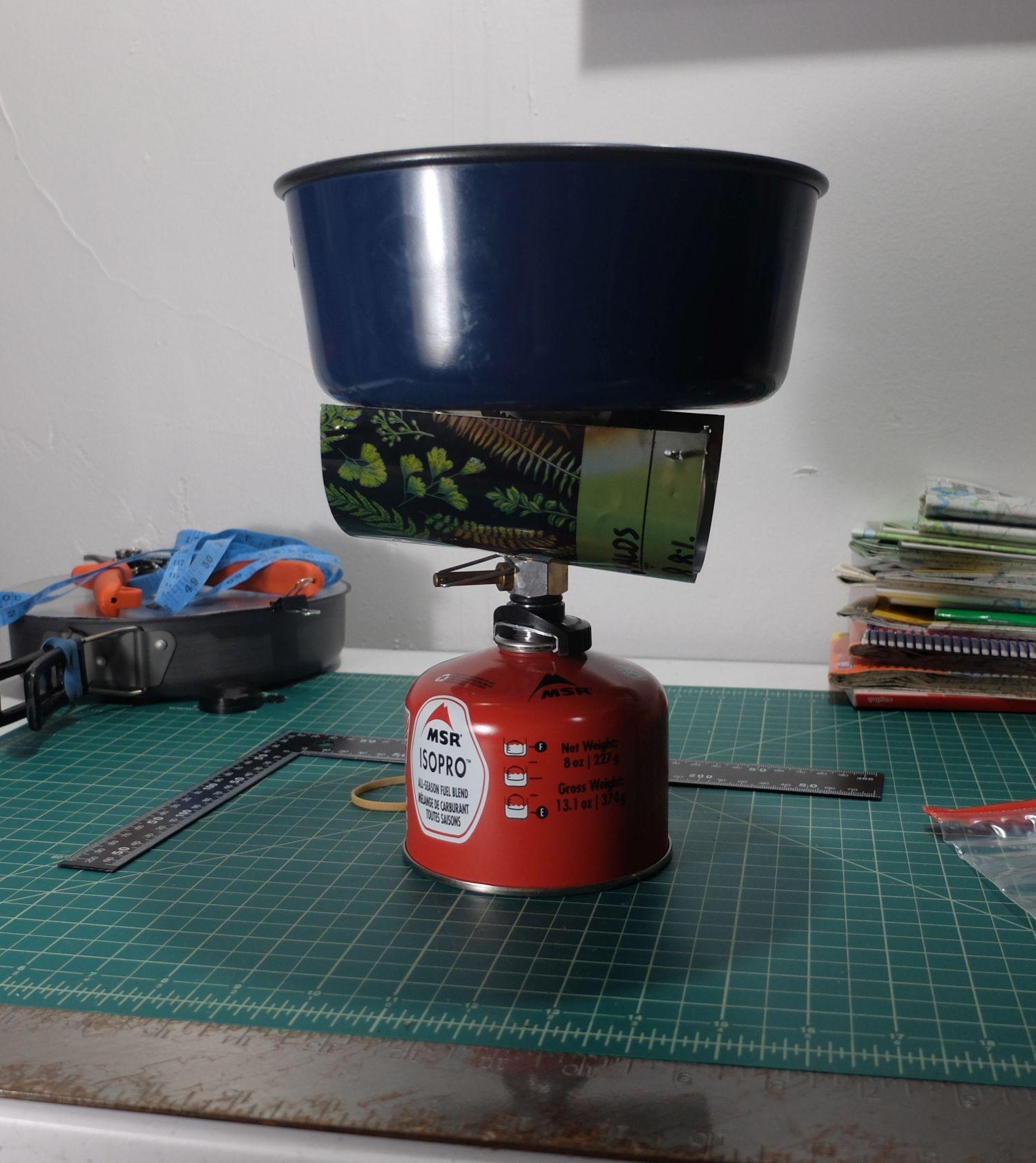 Pot on stove with screen.